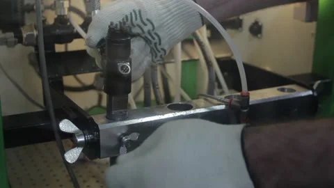 The master works with complex hydraulic equipment Stock Footage 145660867