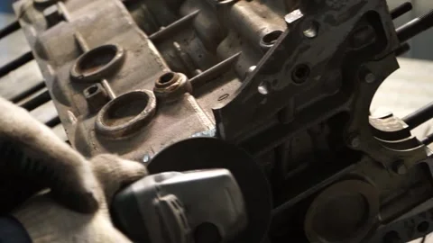 The master works with the disassembled engine on the table Stock Footage 145660849