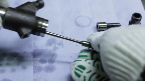 The master works with the disassembled engine on the table Stock Footage 145660852