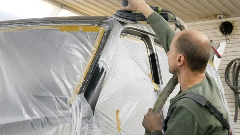 The master works with a grinding machine Stock Footage 100090988