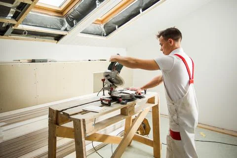 The master works with a special tool is processing boards Stock Photos