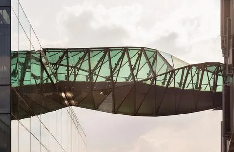 A masterclass in geometric design, the complex twists of the sky bridge at .. Stock Photos