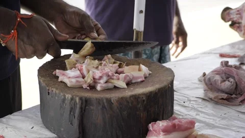 Masterful Meat Preparation  A Culinary Dance with Precision Stock Footage 323997769
