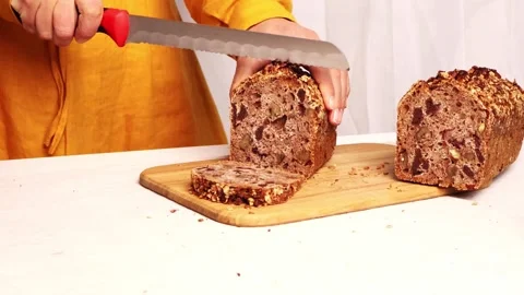 Mastering the art of bread slicing with perfect technique 스톡 동영상 295278730