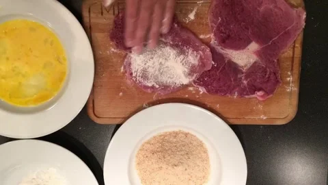 Mastering the art of breading meat at home Stock Footage 320198811