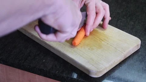Mastering the art of chopping vegetables for delicious meal preparation Stock Footage 294624098