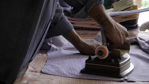 Mastering the Art of Ironing - Expert Techniques for a Polished Look 스톡 동영상 318481311