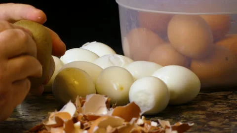 Mastering the Art of Preparation by Peeling Eggs and Boiled Potato Stock Footage 278958026