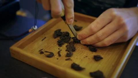 Mastering the art of tea preparation in a cozy setting Stock Footage 296188207