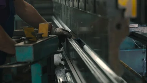 Mastering bending press for efficient part production in a workshop setting Stock Footage 307017326