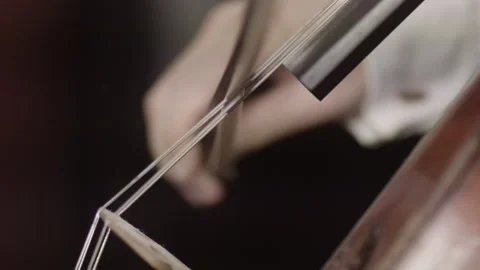 Mastering the Melody Exploring the Art of Cello Music with Strings and Bow Stock Footage 265874897