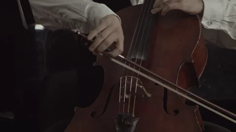 Mastering the Melody Exploring the Art of Cello Music with Strings and Bow Stock-Footage 265874922