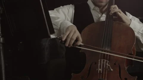 Mastering the Melody Exploring the Art of Cello Music with Strings and Bow Stock-Footage 265875021