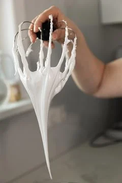 Mastering Meringue Preparation in a Modern Kitchen by a Skilled Pastry Chef Stock Photos