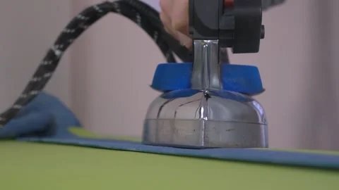 Mastering Precision Ironing Techniques for Achieving Perfect Creases in Your Stock Footage 310250685