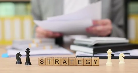 Mastering strategy through careful planning and analysis in a workspace filled Stock Footage 318663288