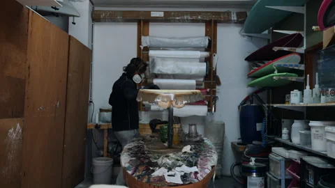 Mastering surfboard shaping in a creative workshop by an expert craftsman Stock Footage 321583561