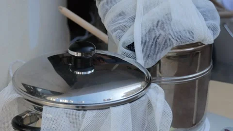 Mastering traditional chai brewing in a cozy kitchen Stock Footage 323575669