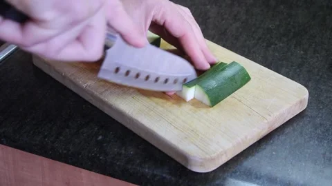 Mastering vegetable preparation skills in a home kitchen setting Stock Footage 294624023
