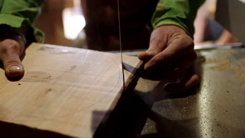 Mastering woodworking techniques through carpenter's precision cutting skills Stock Footage 321385572