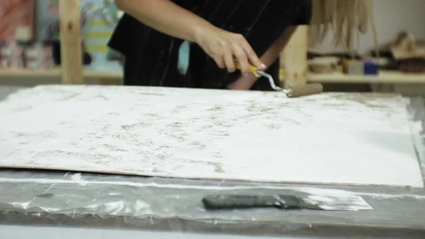 Masters in the art studio process the wood with paint and putty, achieve the Stock Footage 96276677