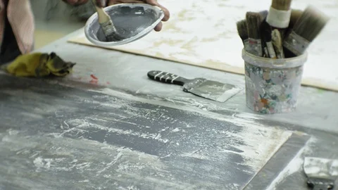 Masters in the art studio process the wood with paint and putty, achieve the Video stock 96277793