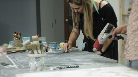 Masters in the art studio process the wood with paint and putty, achieve the Stock Footage 96278266