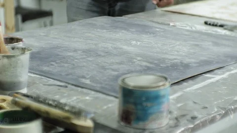 Masters in the art studio process the wood with paint and putty, achieve the Stock Footage 96278632