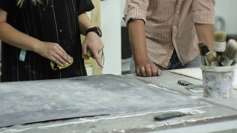 Masters in the art studio process the wood with paint and putty, achieve the Stock Footage 96278733