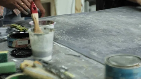 Masters in the art studio process the wood with paint and putty, achieve the Stock Footage 96279018