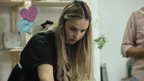 Masters in the art studio process the wood with paint and putty, achieve the Stock Footage 96279229