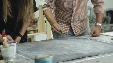 Masters in the art studio process the wood with paint and putty, achieve the Stock Footage 96279330