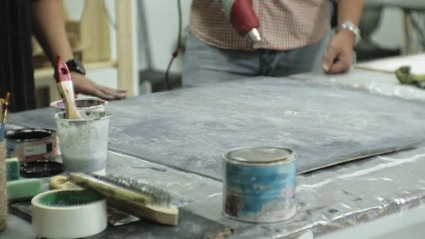 Masters in the art studio process the wood with paint and putty, achieve the Stock Footage 96279424