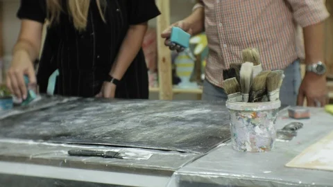 Masters in the art studio process the wood with paint and putty, achieve the Video stock 96280573