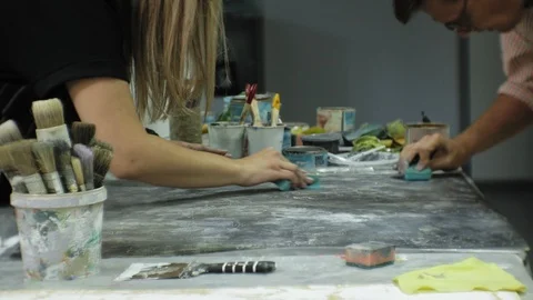 Masters in the art studio process the wood with paint and putty, achieve the Video stock 96280689