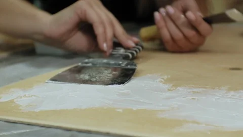 Masters in the art studio process the wood with paint and putty, achieve the Stock Footage 96319199