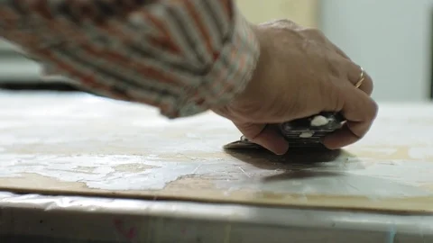 Masters in the art studio process the wood with paint and putty, achieve the Video stock 96319593