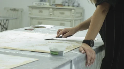 Masters in the art studio process the wood with paint and putty, achieve the Stock Footage 96319659