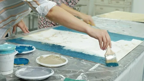 Masters in the art studio process the wood with paint and putty, achieve the Video stock 96329663