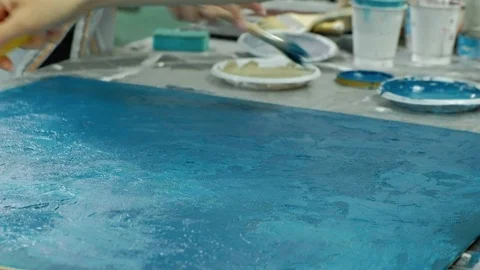 Masters in the art studio process the wood with paint and putty, achieve the Video stock 96330412