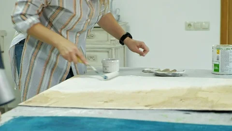 Masters in the art studio process the wood with paint and putty, achieve the Stock Footage 96331000