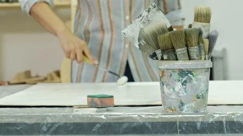 Masters in the art studio process the wood with paint and putty, achieve the Video stock 96331254