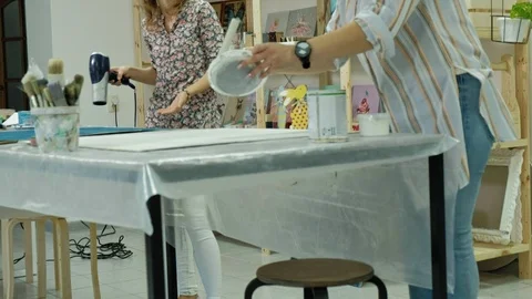 Masters in the art studio process the wood with paint and putty, achieve the Stock Footage 96331347