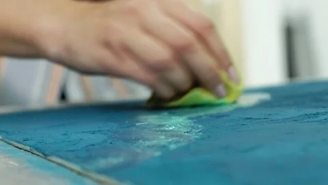 Masters in the art studio process the wood with paint and putty, achieve the Stock Footage 96331528
