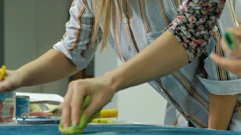 Masters in the art studio process the wood with paint and putty, achieve the Stock Footage 96331583