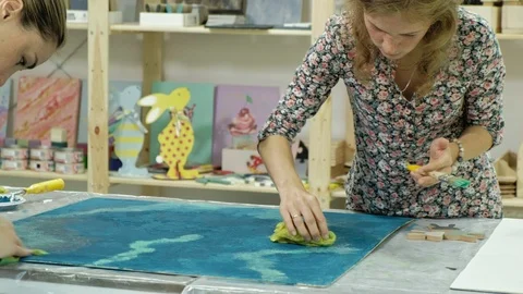Masters in the art studio process the wood with paint and putty, achieve the Stock Footage 96331696