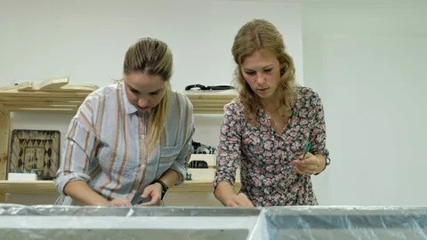 Masters in the art studio process the wood with paint and putty, achieve the Video stock 96332001