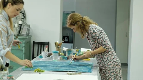 Masters in the art studio process the wood with paint and putty, achieve the Stock Footage 96332962