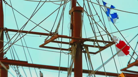 Masts and rigging of three-masted sailing ship over the bright blue sky Stock-Footage 61073729