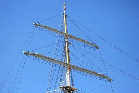 Masts of the sailboat on the background of the sky Stock Photos